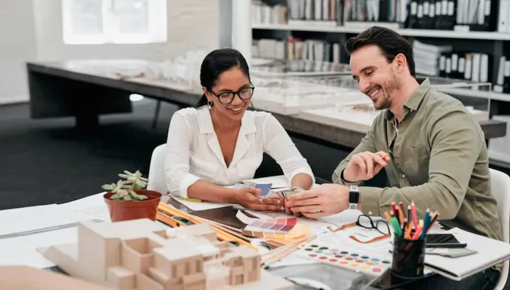 Just take a look at this cropped shot of two aspiring young architects smiling while working together Just take a look at this cropped shot of two aspiring young architects smiling while working together